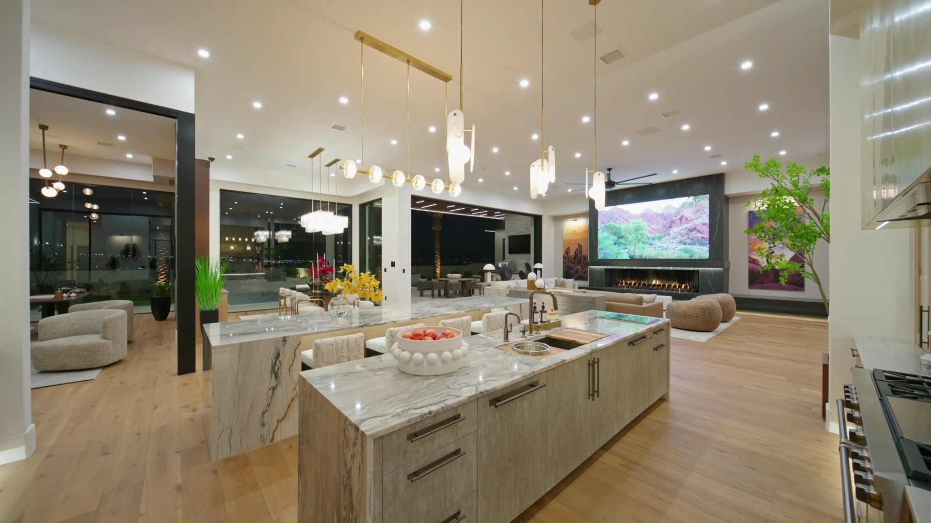 Great room and kitchen: Lights On, TV on, fireplace on