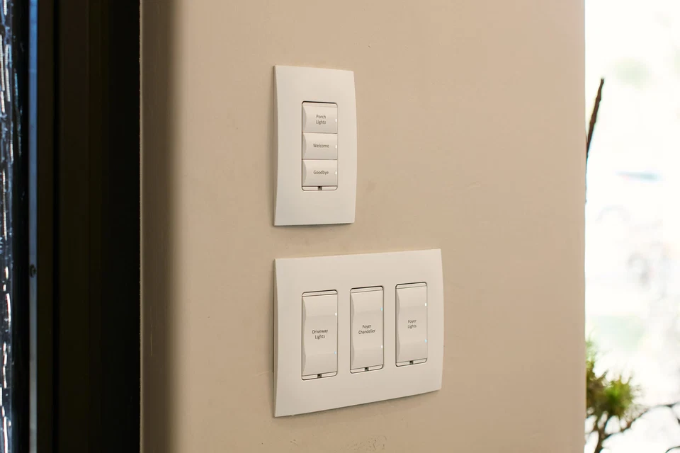 White lighting keypad above a row of wall switches
