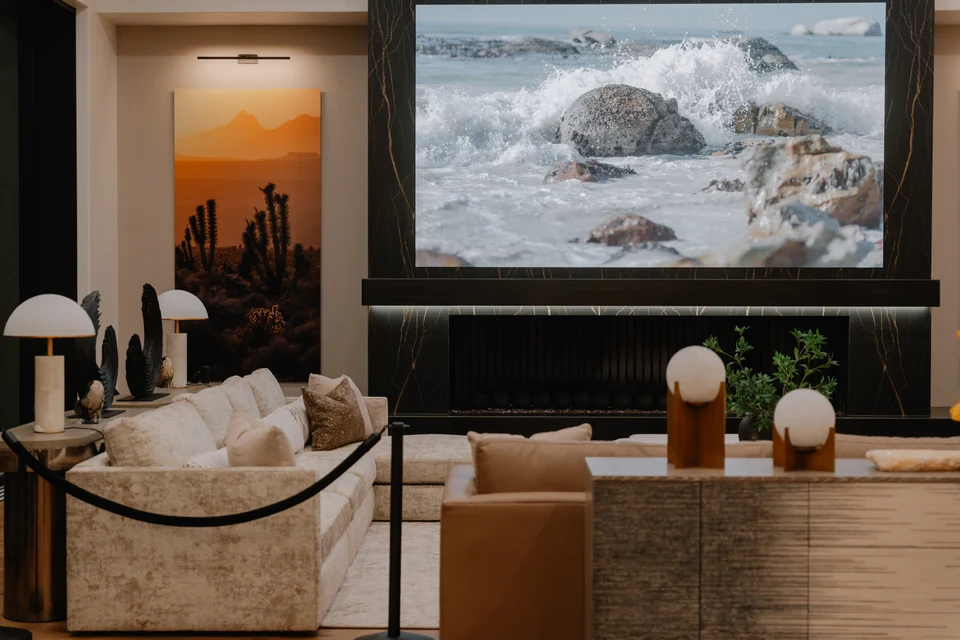 Luxury great room with integrated video wall, fireplace lighting, and architectural illumination by TEK-IT