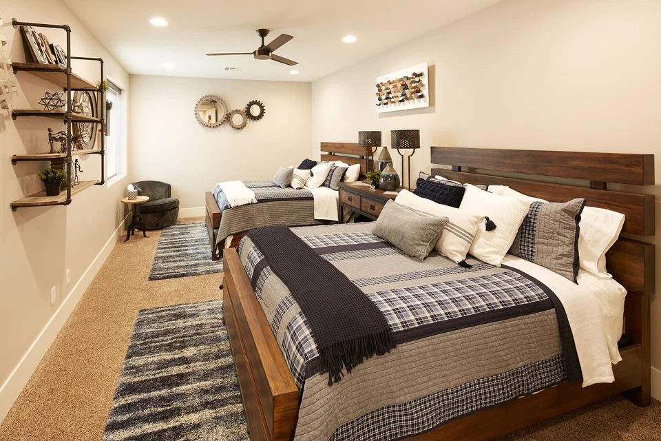 Guest room with dark wood headboards and wall-mounted reading lights
