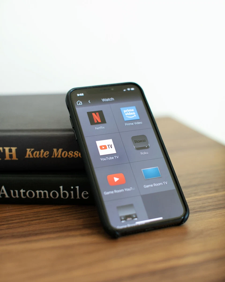 Angled view of colorful home-control tiles on a smartphone