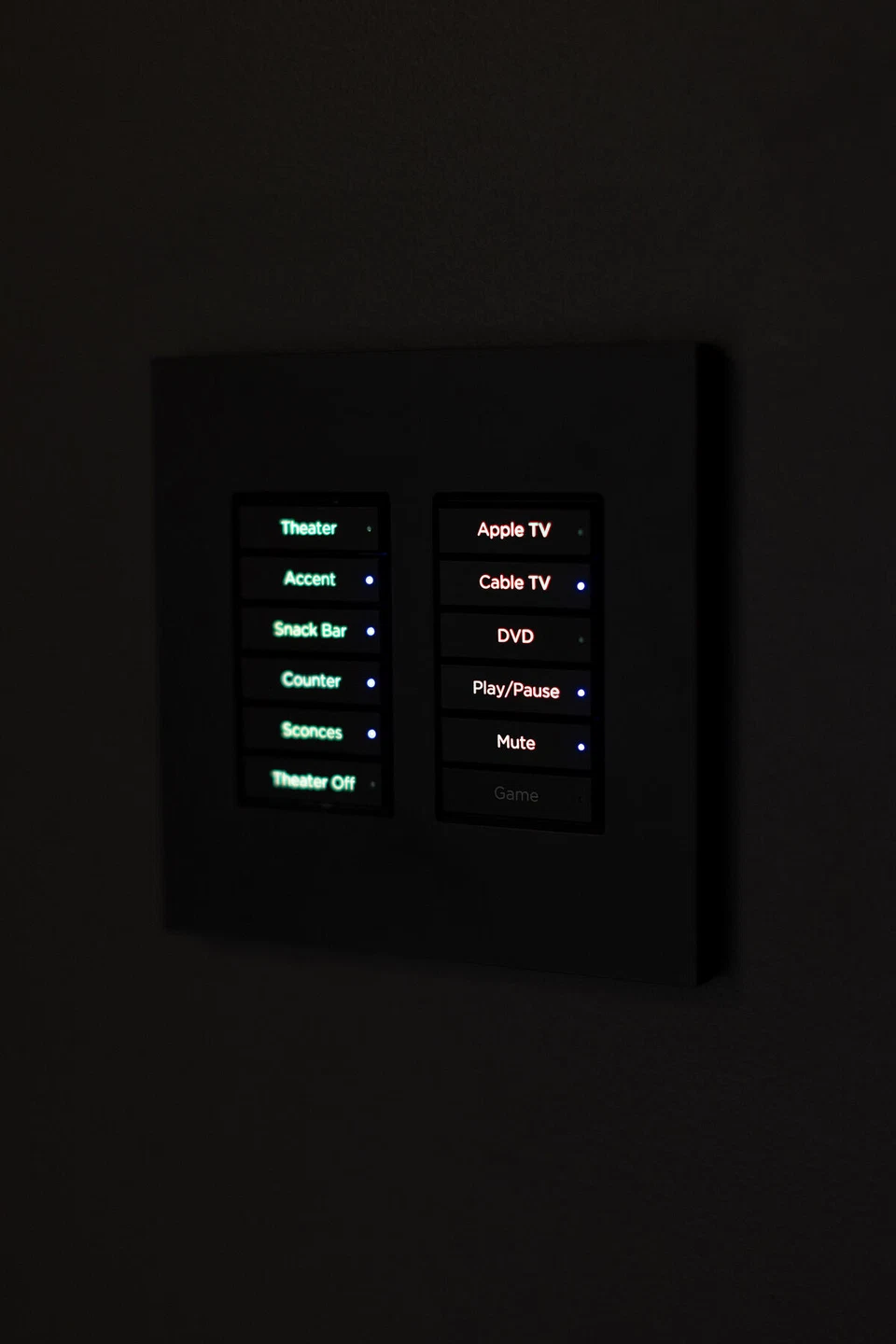 Black home theater wall keypad with illuminated scene buttons