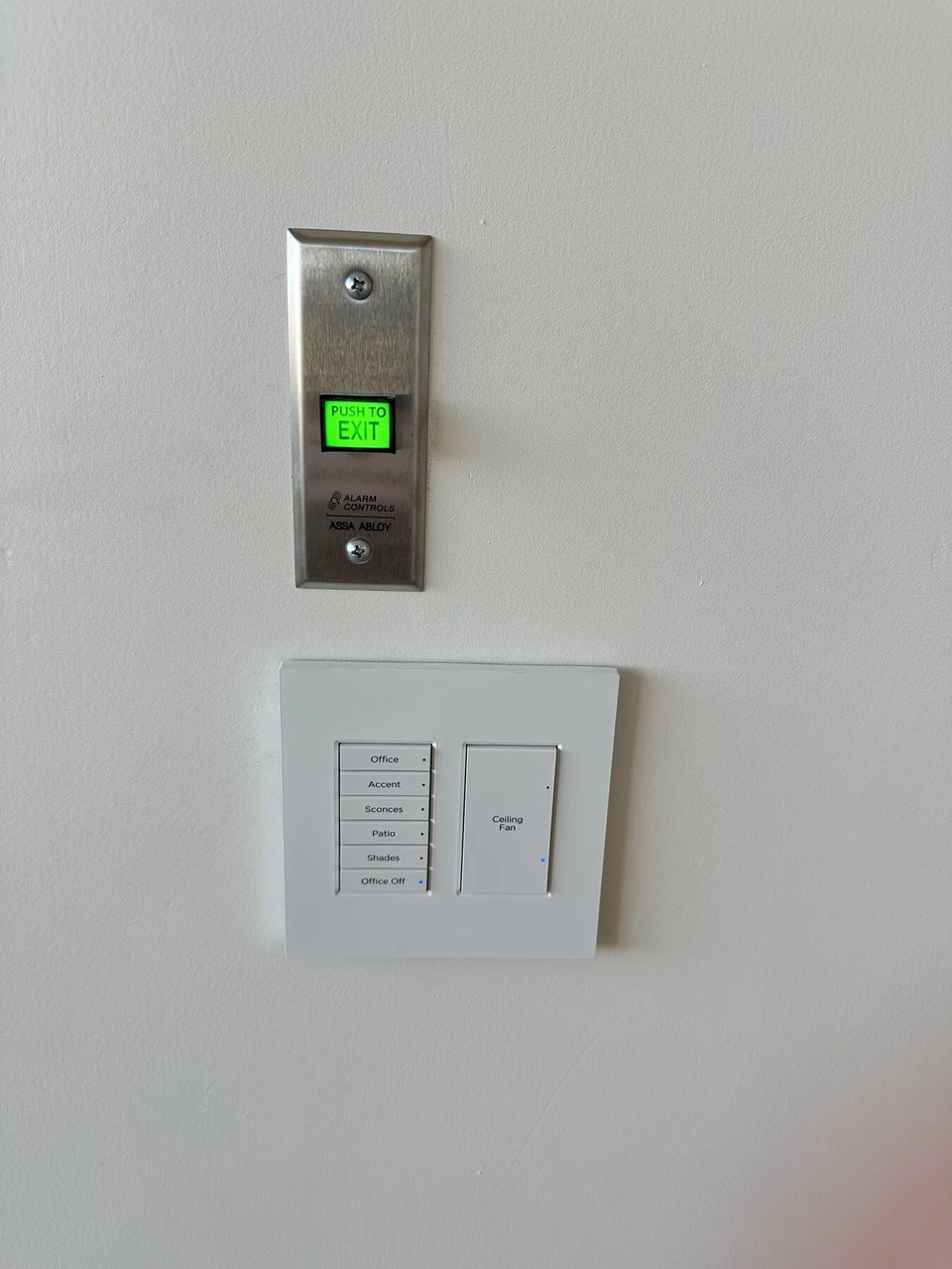 Wall-mounted door sensor and white lighting controls